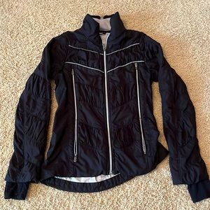Lululemon wind breaker. Black with silver/grey detail. Size 2.